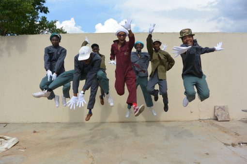 Jumping Group in Work Uniforms